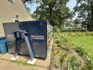 21 yard dumpster rental in Kent County driveway with Rolliskate protection pads