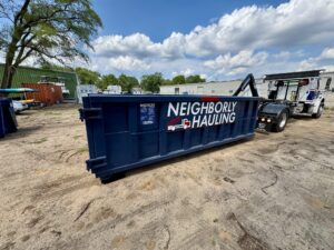 Neighborly Hauling 17-yard dumpster with Rolliskate pads in West Michigan